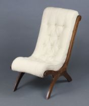 A Victorian beech framed slipper shaped nursing chair upholstered in white buttoned material 65cm