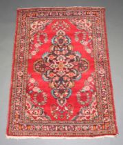 A red and blue ground Persian rug with central medallion 162cm x 114cm Fringe reduced, flecking