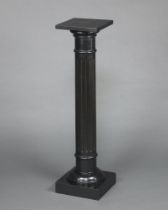 A Victorian ebonised fluted column/torchere with square top, raised on a square base 108cm h x