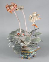 A Chinese hardstone model of a plant contained in a hexagonal cloisonne enamelled base 48cm h x 21cm