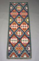 A green, tan and white ground Maimana Kilim runner with all over diamond design 188cm x 66cm