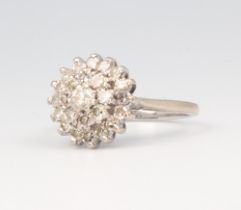 A white metal 18ct diamond cluster ring approx. 0.25ct, 3.5 grams, size F