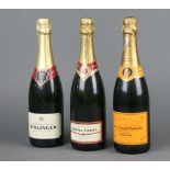 A bottle of Bollinger champagne, a bottle of Veuve Clicquot champagne and a bottle of Duval-Leroy