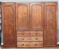 A Victorian mahogany triple breakfront wardrobe with moulded cornice, the centre upper section