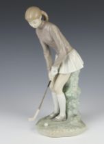 A Lladro figure of a lady golf player 4651 28cm