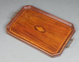 An Edwardian octagonal inlaid mahogany twin handled tea tray, the centre inlaid a shell 61cm x