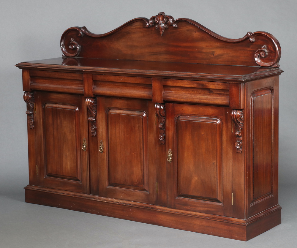 A Victorian style chiffonier sideboard with carved raised shaped back, the base fitted 3 drawers