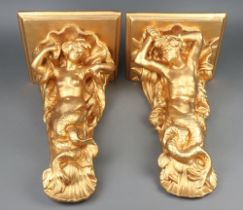 A pair of gilt painted wall brackets in the form of mermaids 50cm x 30cm x 25cm