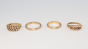Three 9ct yellow gold rings sizes J 1/2, N 1/2, L 1/2, 8.3 grams, an 18ct ditto size N 1/2 1.2 grams
