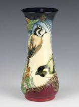 A modern Moorcroft vase with waisted neck, decorated a garden with birds, Inglewood 2003 20cm