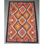 A black, white and orange ground Maimana Kilim rug with all over diamond design 158cm x 100cm