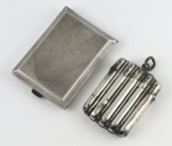 A Victorian silver vesta Birmingham 1891 with ribbed decoration and a silver match sleeve holder