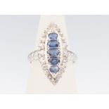 A white metal marquise sapphire and diamond ring, the sapphires approx. 1ct, brilliant cut