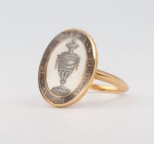 An 18th Century yellow metal and enamelled oval mourning ring inscribed Ann Pearson OB.26.APR.1779