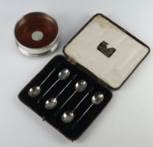 A Georgian style silver bottle coaster Birmingham 2001, 9cm and 6 silver bean end coffee spoons
