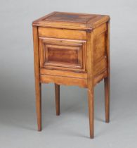 An Edwardian rectangular Continental mahogany pot cupboard with hinged lid and fall front, raised on