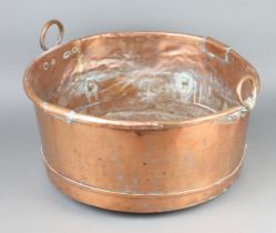 A circular 19th Century twin handled copper copper 26cm h x 53cm With old repairs