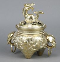 A Japanese polished bronze twin handled censor the body decorated dragons and with elephant mask