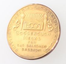 A 9ct yellow gold medallion from the British Compressed Gases Association inscribed "Goodenough