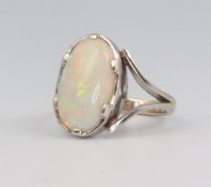 A white metal 9ct oval opal ring, 3.9 grams, size I