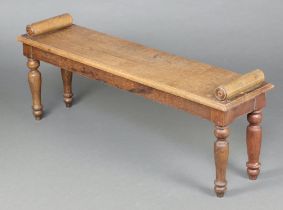 A 19th Century rectangular oak hall/window bench with scroll arms, raised on turned supports 48cm