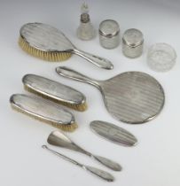 An engine turned silver dressing table set Birmingham 1925 comprising hand mirror, hair brush, 2