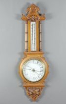 A Barrett & Russell of Leeds Victorian aneroid barometer and thermometer with porcelain dial,