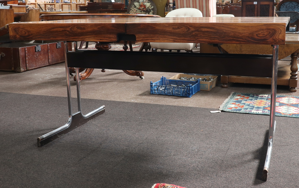 A 1970's Pieff style rosewood extending dining table, raised on figured chrome supports with - Image 7 of 7