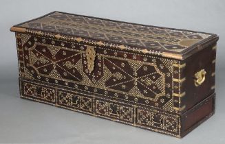 An Eastern hardwood and gilt studded coffer with hinged lid, the interior fitted 2 candle boxes, the