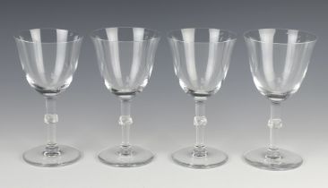 Four Lalique wine glasses with twist knops, lower cased engraved marks 15cm