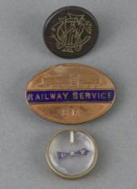 A Second World War double sided escape and evasion compass, a WWII railway service badge for