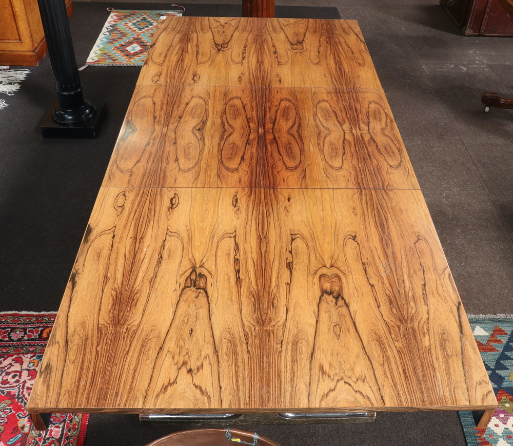 A 1970's Pieff style rosewood extending dining table, raised on figured chrome supports with - Image 3 of 7