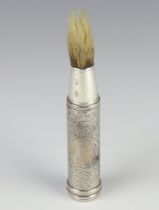 A Victorian silver travelling shaving brush with engraved scroll decoration and vacant cartouche,