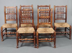 A harlequin set of 6 elm spindle back dining chairs with woven rush seats 97cm h x 51cm w x 42cm
