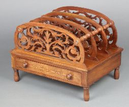 A Victorian bleached and inlaid mahogany 3 division Canterbury with fret work dividers the base