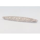 An Edwardian white metal elliptical diamond brooch, the 5 large stones approx. 0.3ct, 55mm, 4 grams