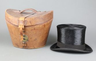 Scott and Company, a gentleman's black top hat, size 6 3/4, complete with leather carrying case, the