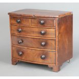 A 19th Century mahogany bow front apprentice chest fitted 4 long drawers on bracket feet with tore