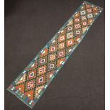 A green and white ground Maimana Kilim runner with diamond design 407cm x 77cm