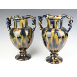 A pair of 19th Century continental pottery twin handled vases 31cm One is extensively stuck
