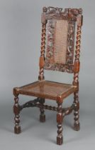 A Charles II carved walnut and cane chair atop pierced foliate cresting rail with central Boyes