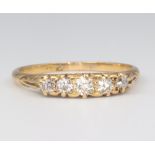 A yellow metal 18ct 5 stone diamond ring, approx. 0.35ct size Q 1/2, 3 grams