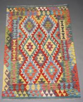 A turquoise, tan, white and green ground Chobi Kilim rug 154cm x 103cm