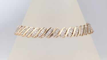 A 9ct yellow gold diamond set bracelet 18cm, 15.5 grams