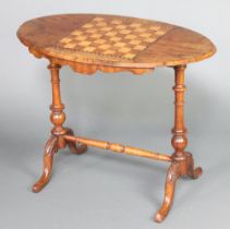 A Victorian oval inlaid walnut stretcher table, the top inlaid a chessboard raised on turned