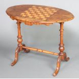 A Victorian oval inlaid walnut stretcher table, the top inlaid a chessboard raised on turned