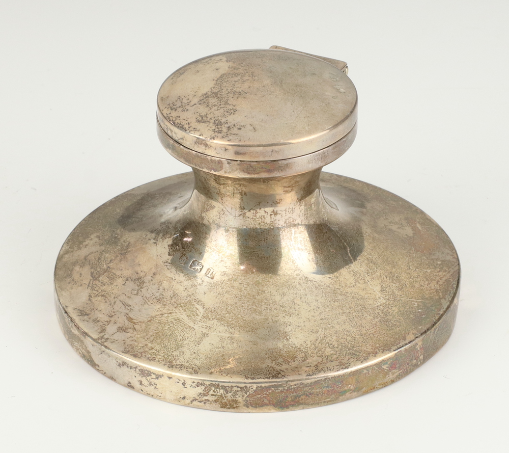 A silver circular capstan inkwell Birmingham 1916, 11cm This is 7cm high and 11 cm in diameter The