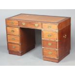 20th Century mahogany finished military style desk with brown inset leather writing surface above