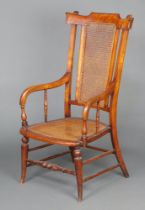 A 19th Century mahogany stick back open arm chair with woven cane panels to the back and seat,