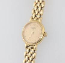 A lady's Longines 18ct yellow gold quartz wristwatch, case numbered 30455587 18mm, on an 18ct yellow